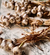 dried garlic on a marble countertop